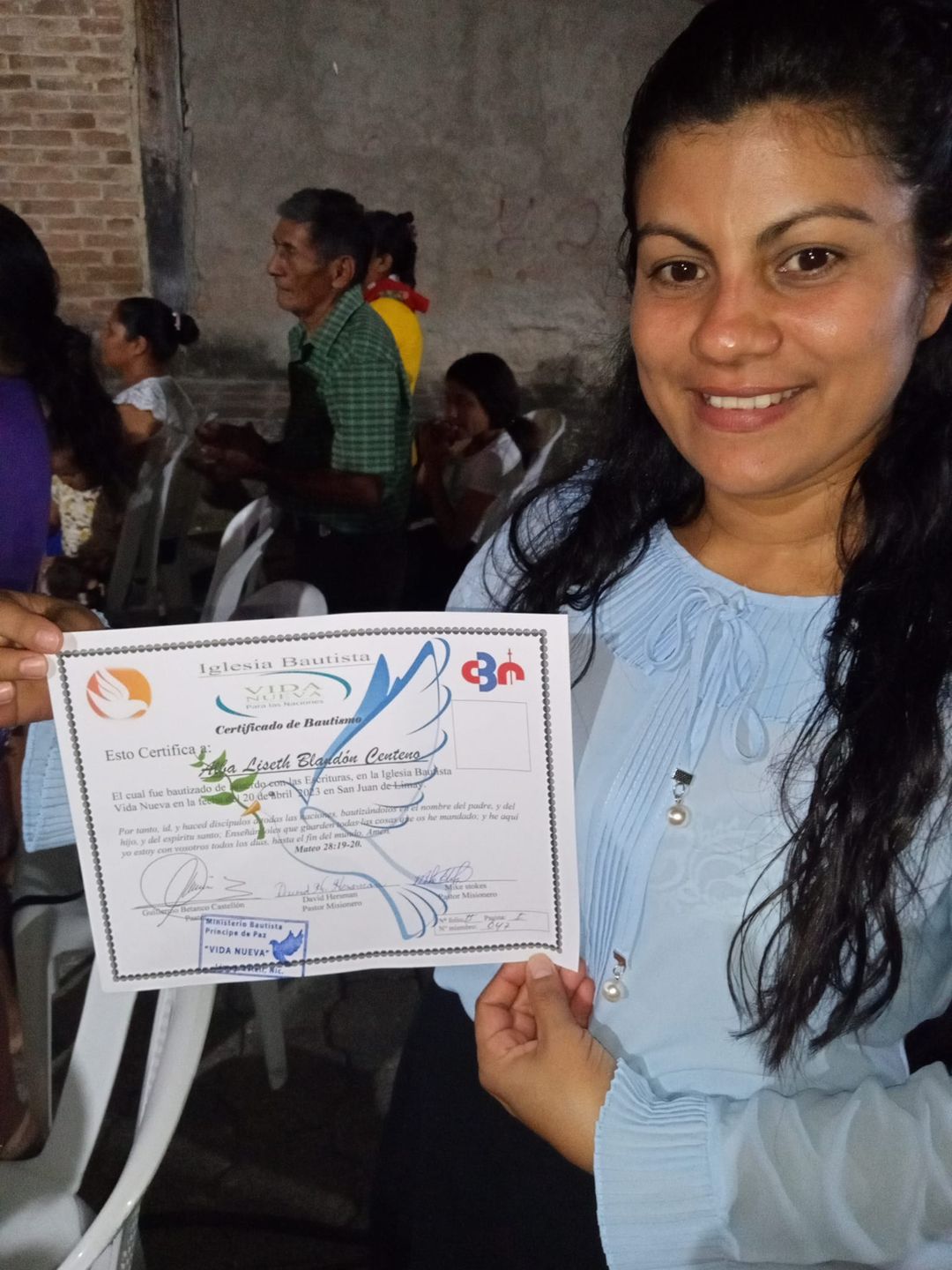 Alba with her Baptismal certificate