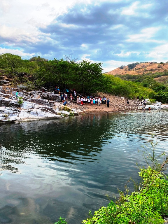 The beautiful baptismal scene from the other side of the river.